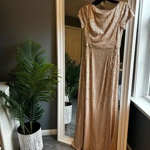 Gold sequin dress with back zipper. Pristine condition, worn once, floor length.